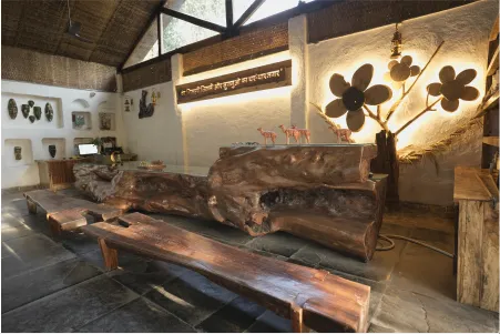 Lounge with a sofa carved from a single fallen tree trunk